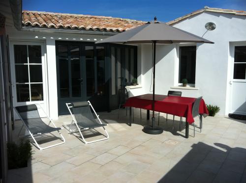 Photo 1 : NC d'une maison située à La Couarde-sur-mer, île de Ré.